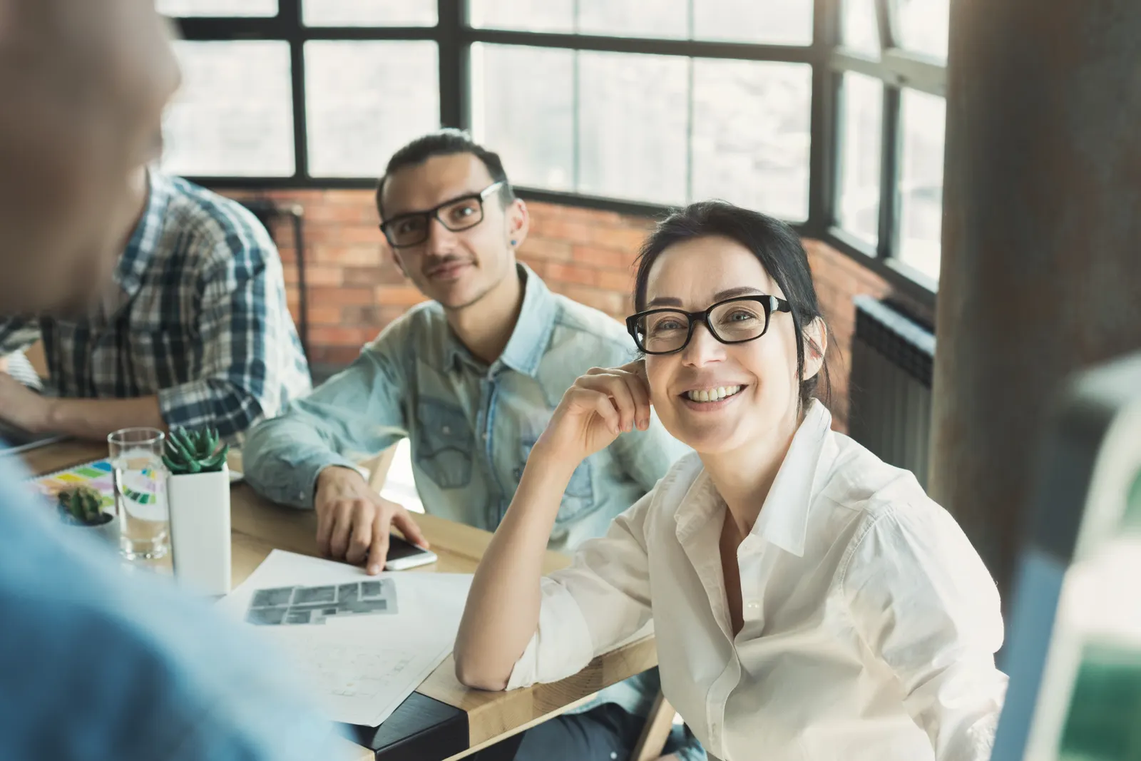 Colleagues smiling during a working session