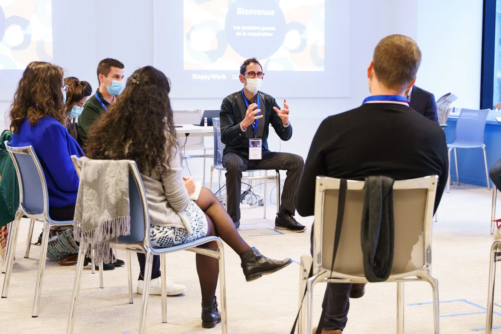 Participants seated in a circle during a NextGen session