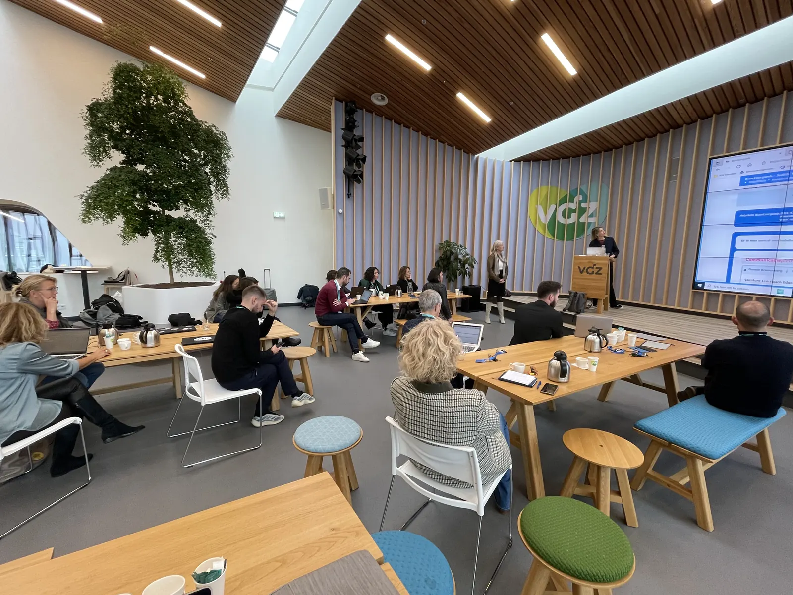 A NextGen learning expedition group at a presentation in a host company's hall in the Netherlands